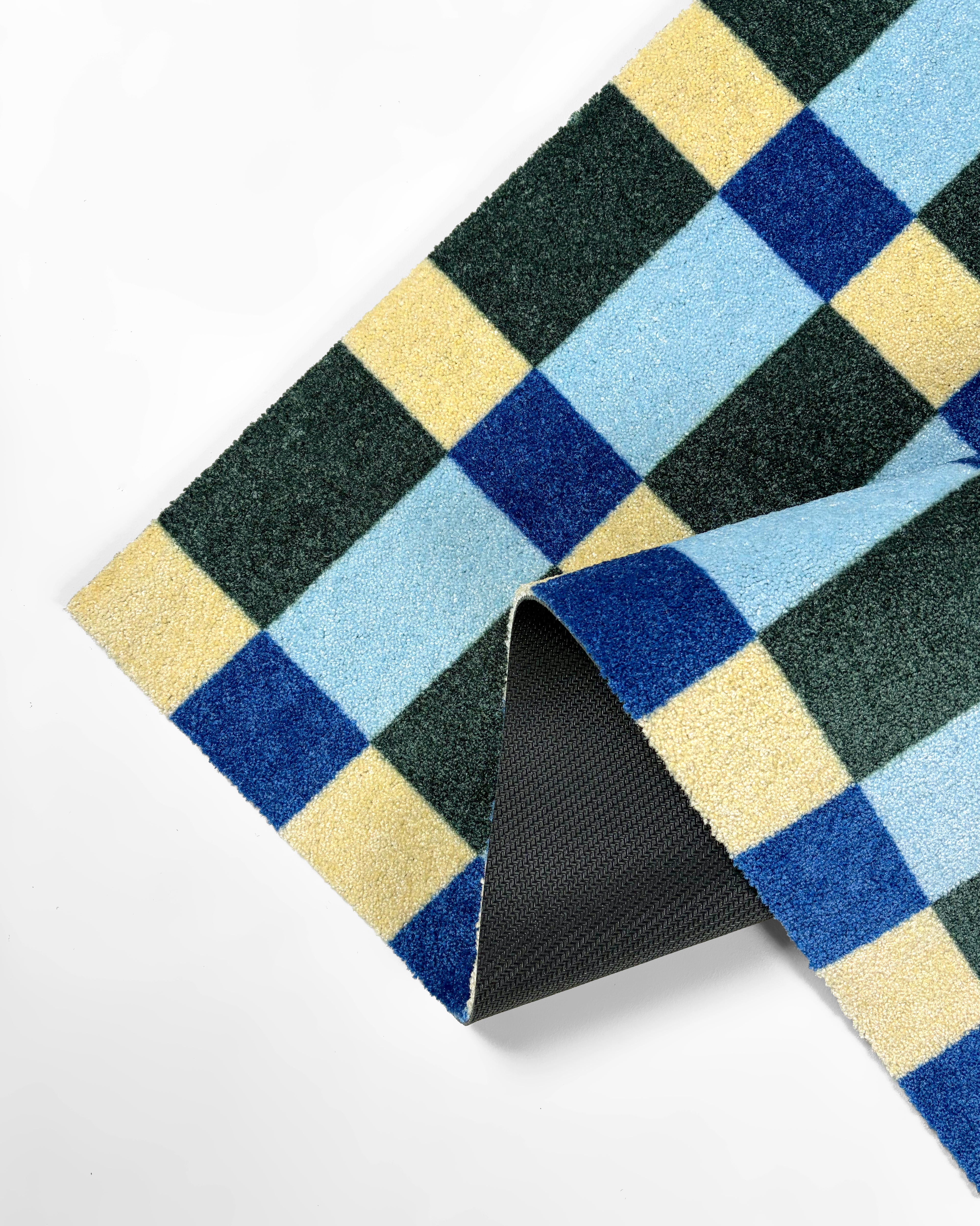 Folded cream, light blue, navy and dark green custom size check pattern doormat
