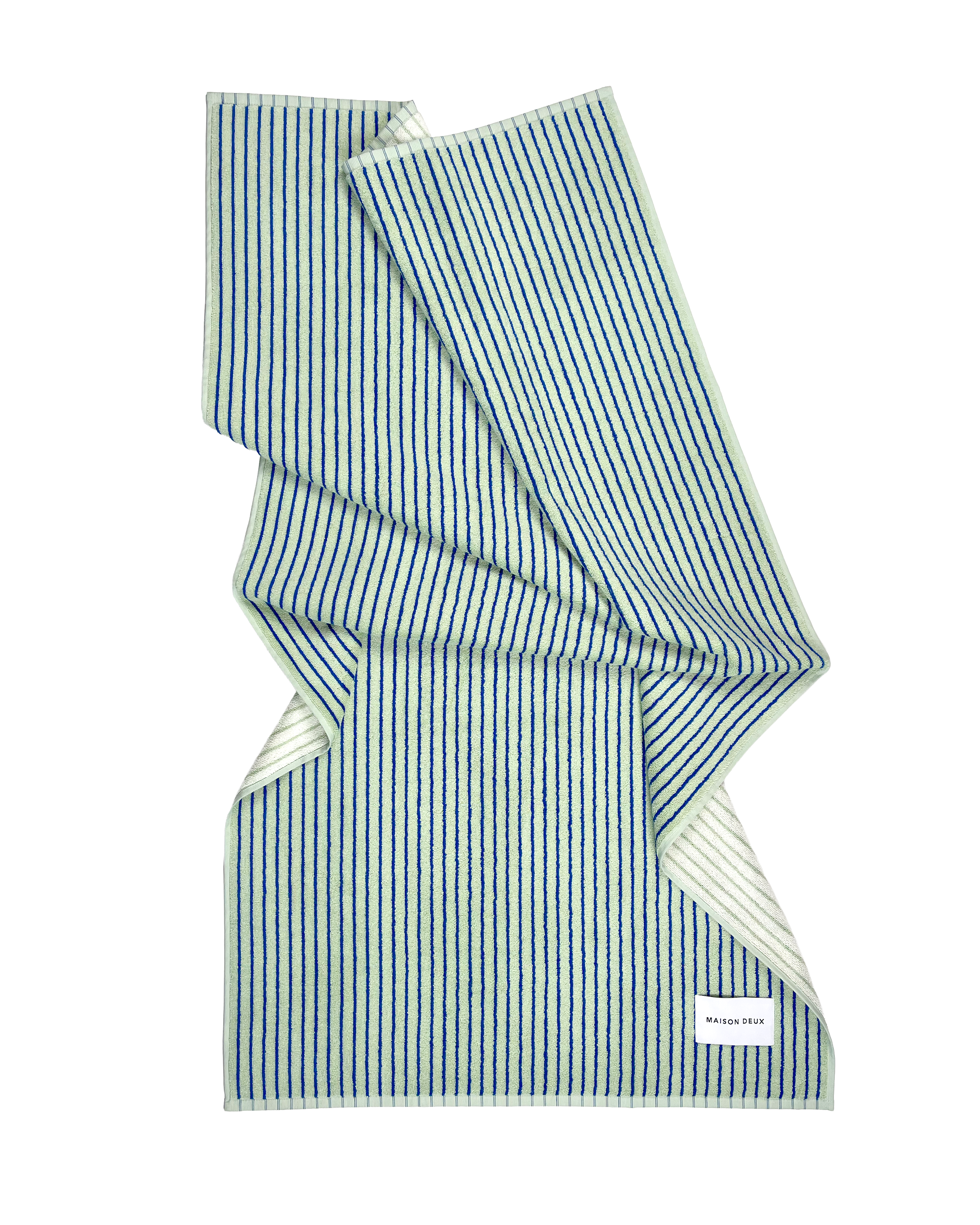Folded sage green striped beach towel, organic cotton terry
