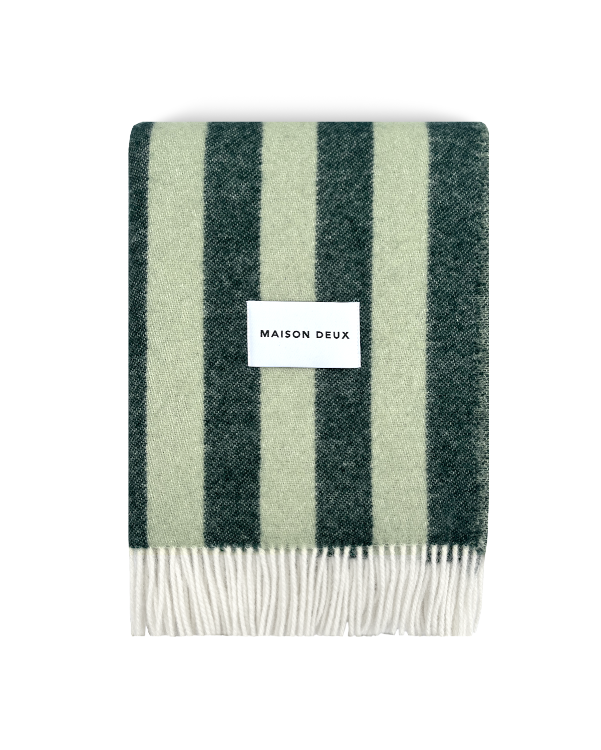 Dark green and sage striped wool blanket folded with fringe detail
