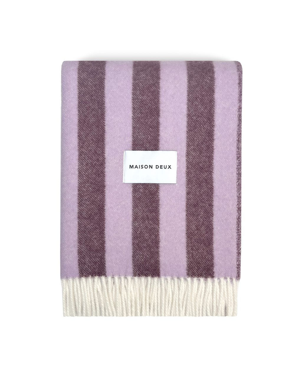 Lilac and aubergine striped wool blanket folded with fringe detail
