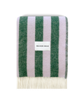 Lilac and green striped wool blanket folded with fringe detail
