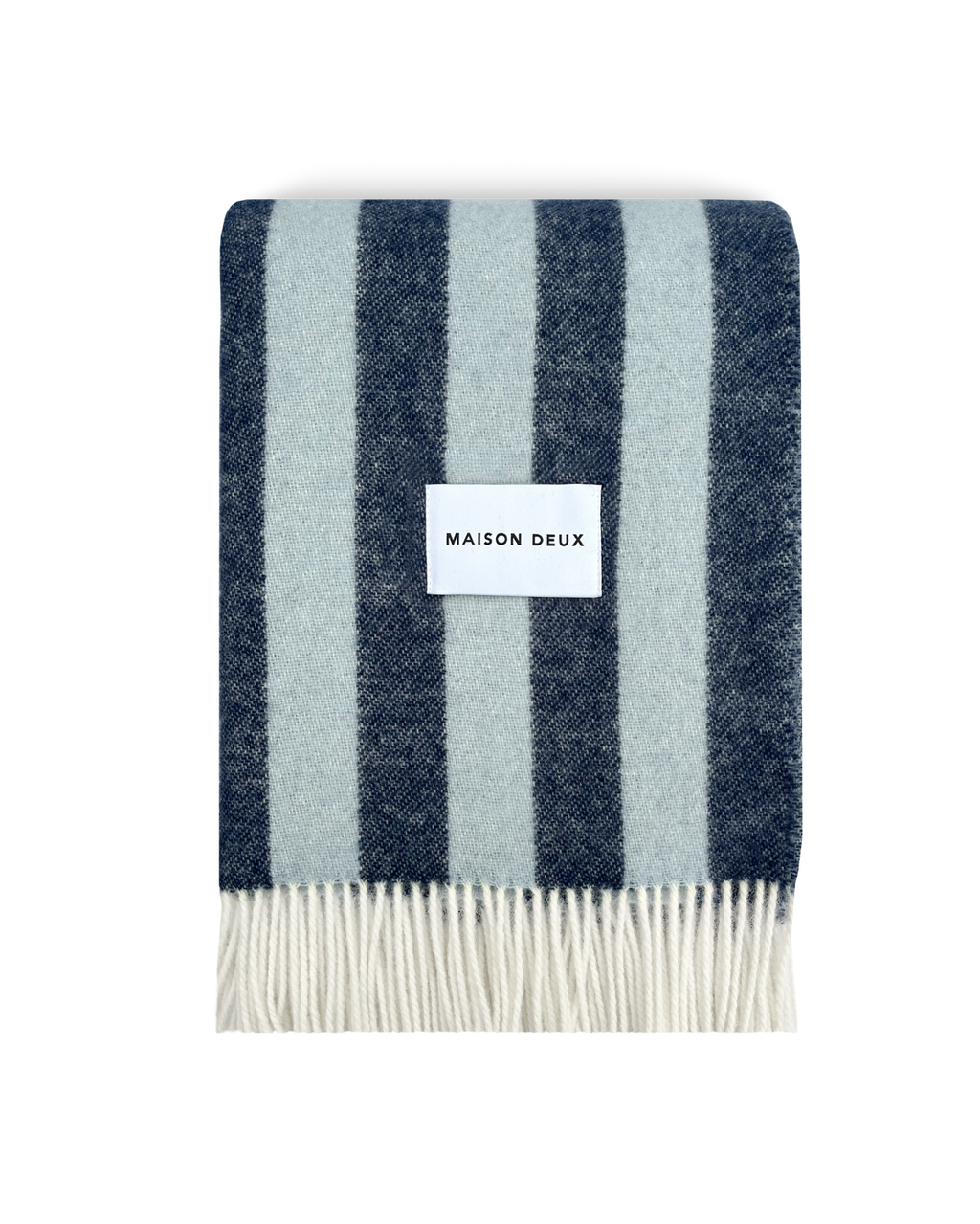 Navy and light blue striped wool blanket folded with fringe detail
