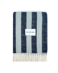 Navy and light blue striped wool blanket folded with fringe detail
