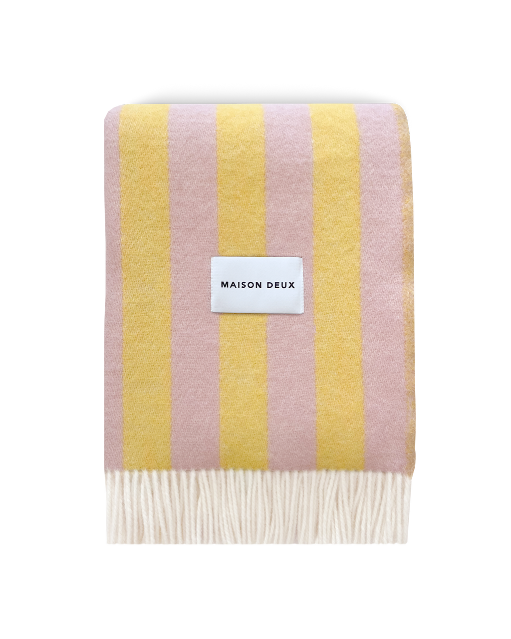 Pink and yellow striped wool blanket folded with fringe detail
