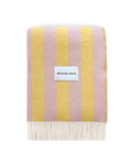 Pink and yellow striped wool blanket folded with fringe detail
