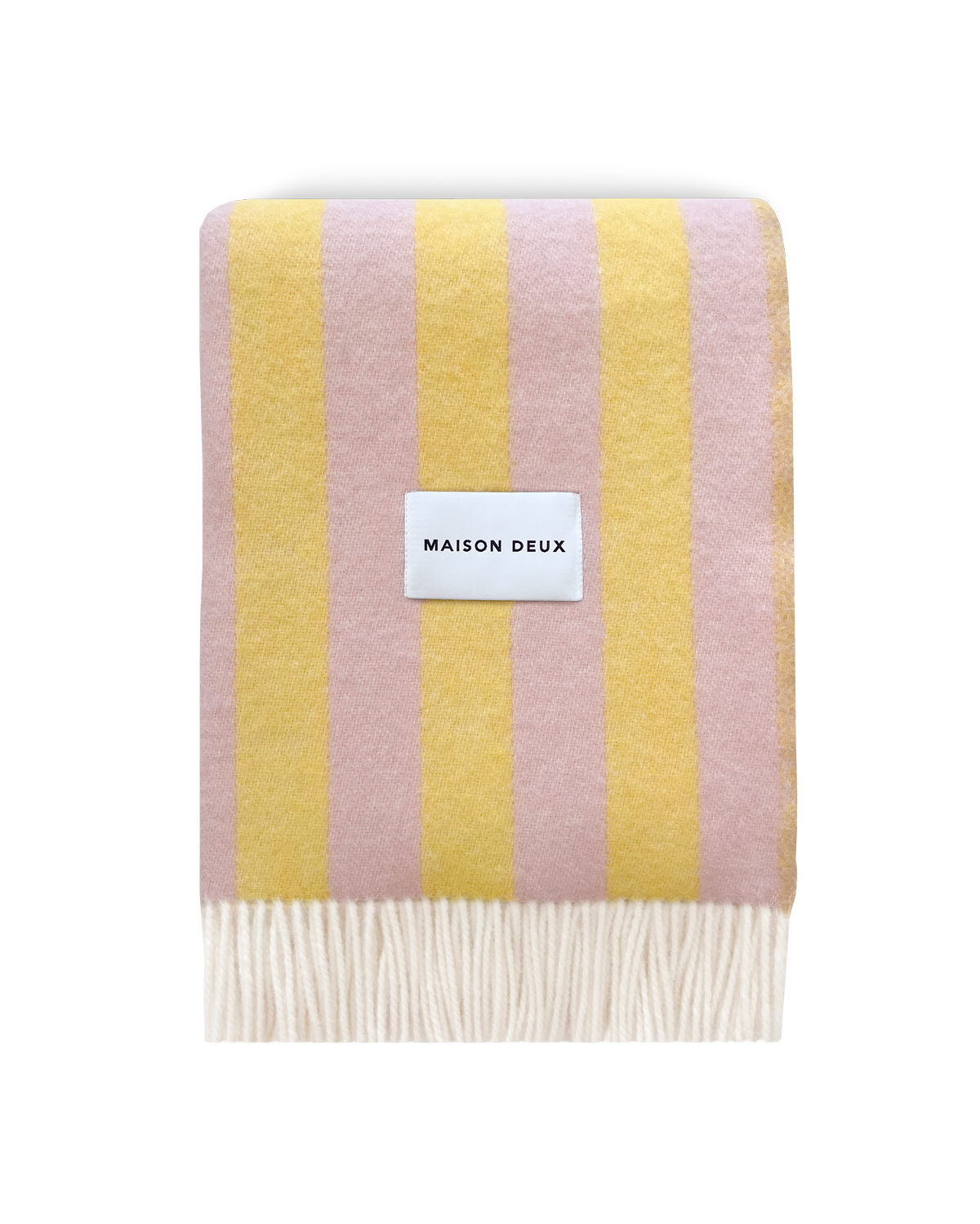 Pink and yellow striped wool blanket folded with fringe detail
