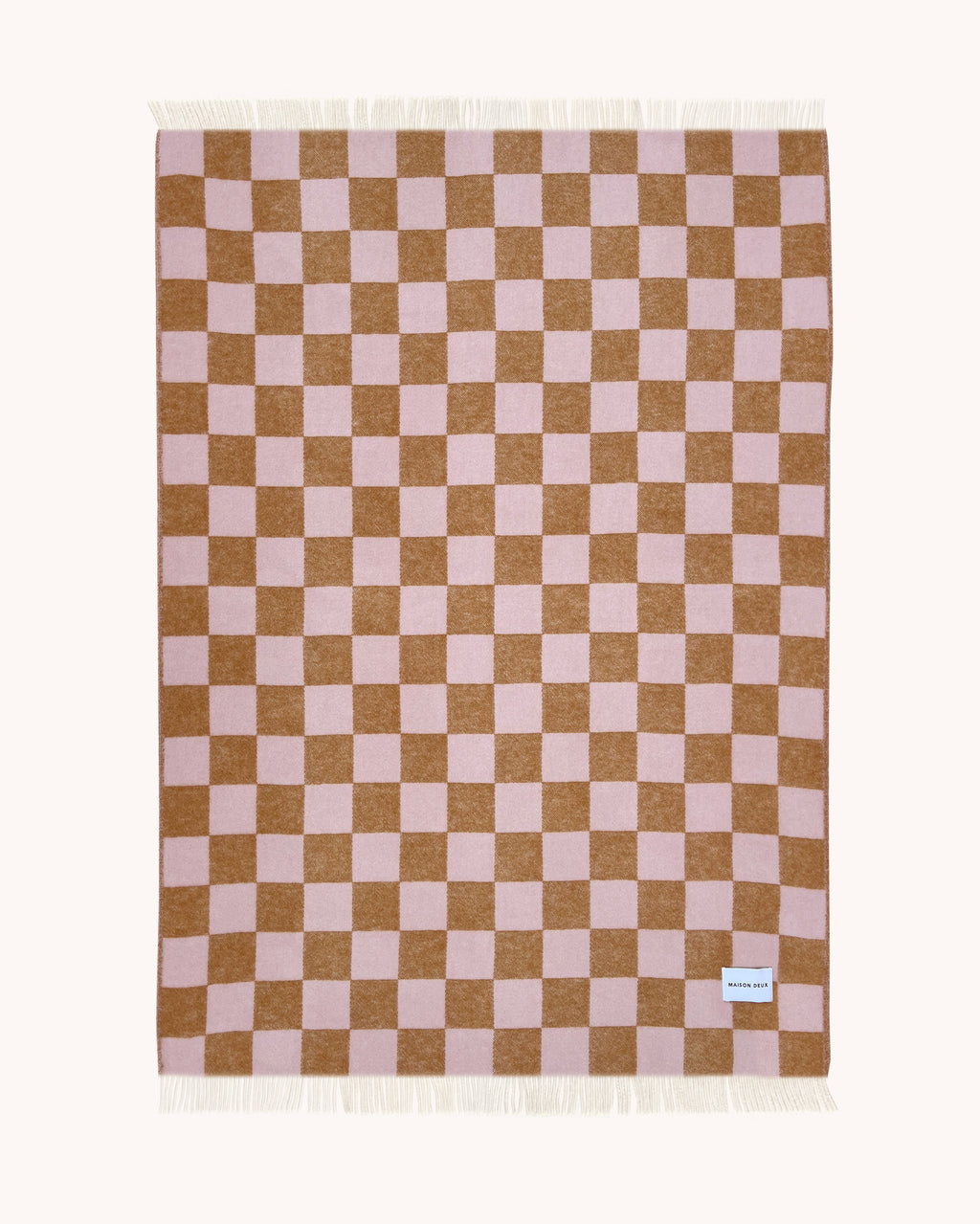 Terracotta and pink checkerboard wool throw shown flat
