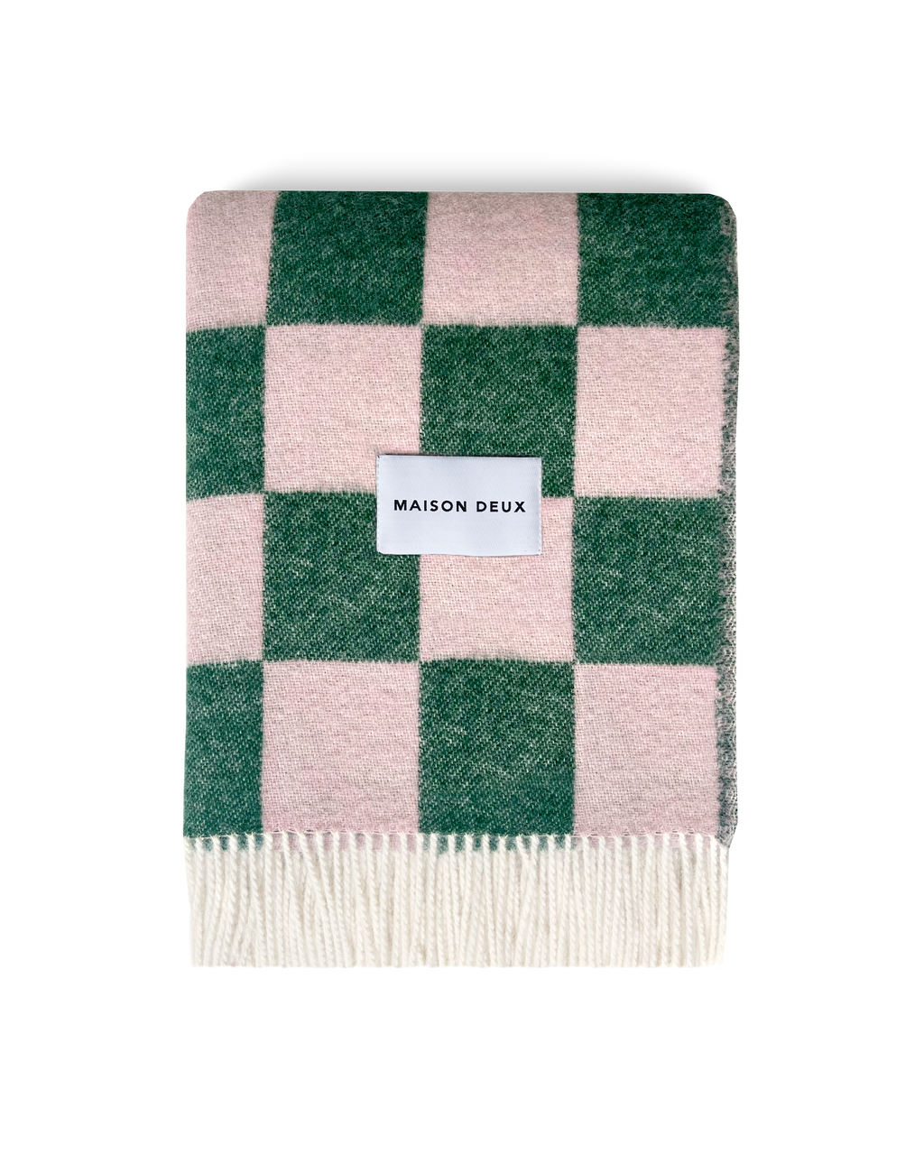 Green and pink checkerboard wool blanket folded with fringe detail
