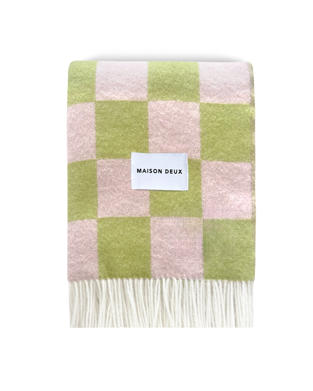 Lime green and pink checkerboard wool blanket folded with fringe detail
