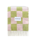 Lime green and pink checkerboard wool blanket folded with fringe detail
