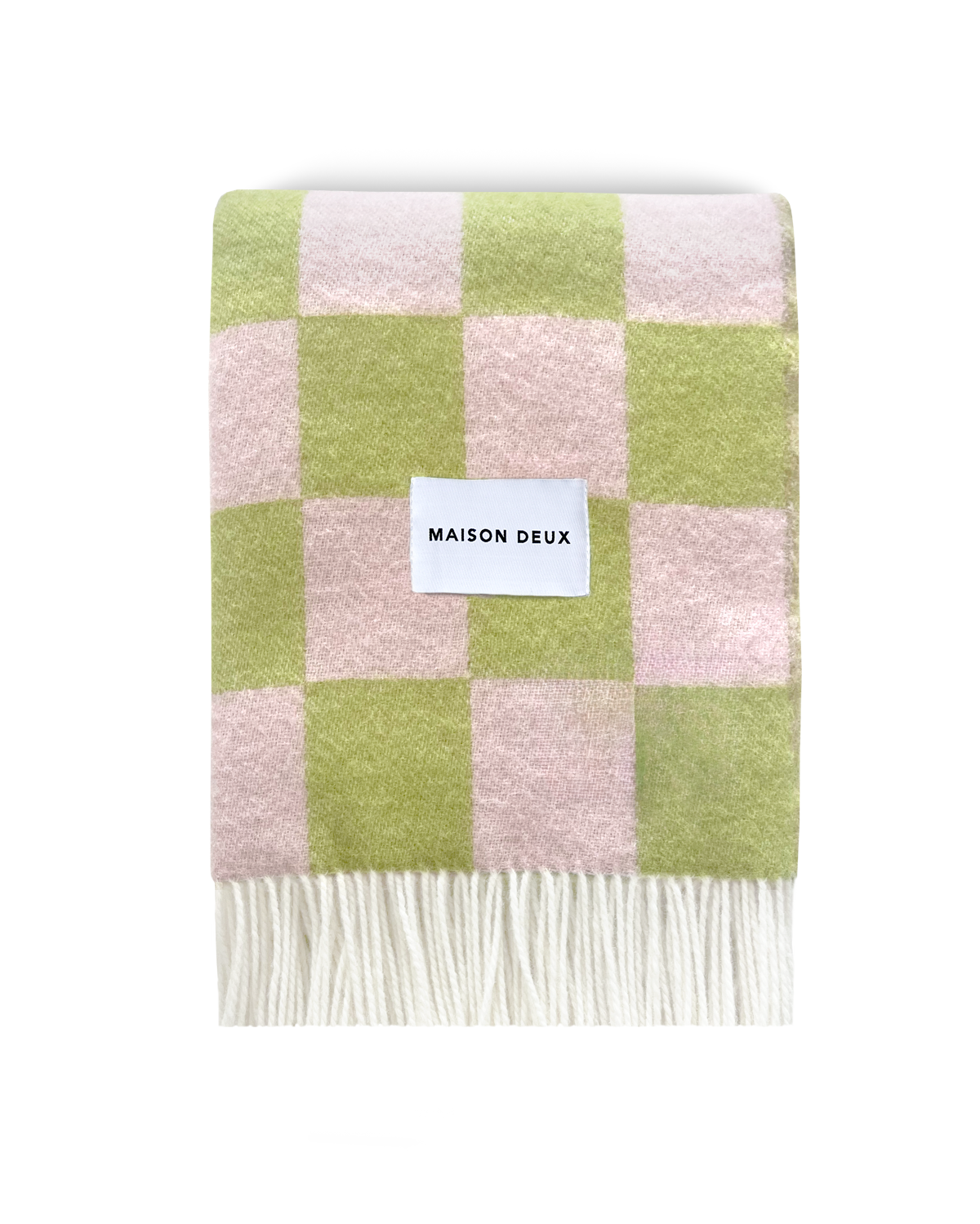 Lime green and pink checkerboard wool blanket folded with fringe detail
