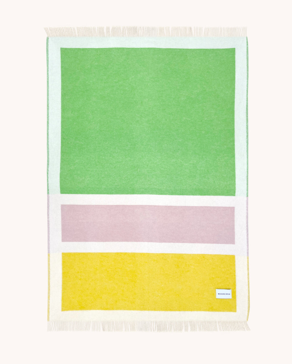 Green, pink, and yellow color block wool throw
