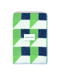 Apple green and navy geometric wool blanket folded with stitched edge detail
