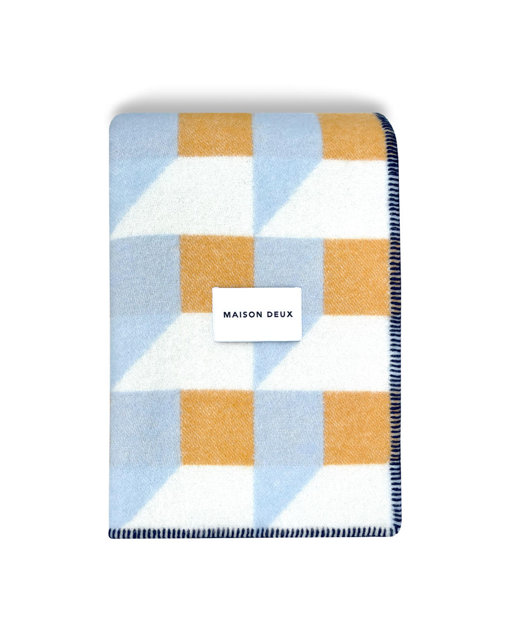 Light blue and honey yellow geometric wool blanket folded with stitched edge detail
