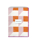 Pink and carrot orange geometric wool blanket folded with stitched edge detail
