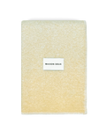  Butter yellow wool blanket folded with stitched edge detail
