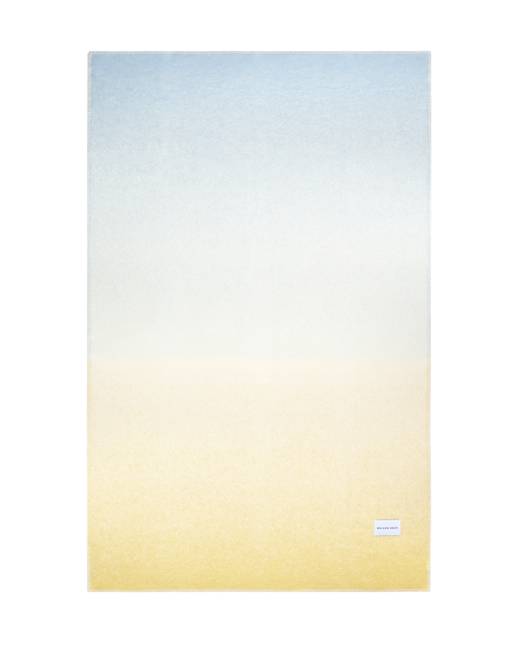 Light blue to butter yellow gradient wool throw shown flat
