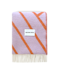 Lilac and orange diagonal striped wool blanket folded with fringe detail
