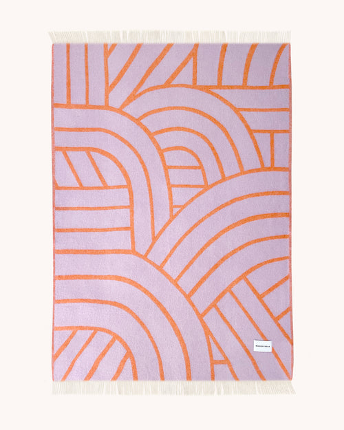 Lilac and orange wool throw with curved arch line pattern
