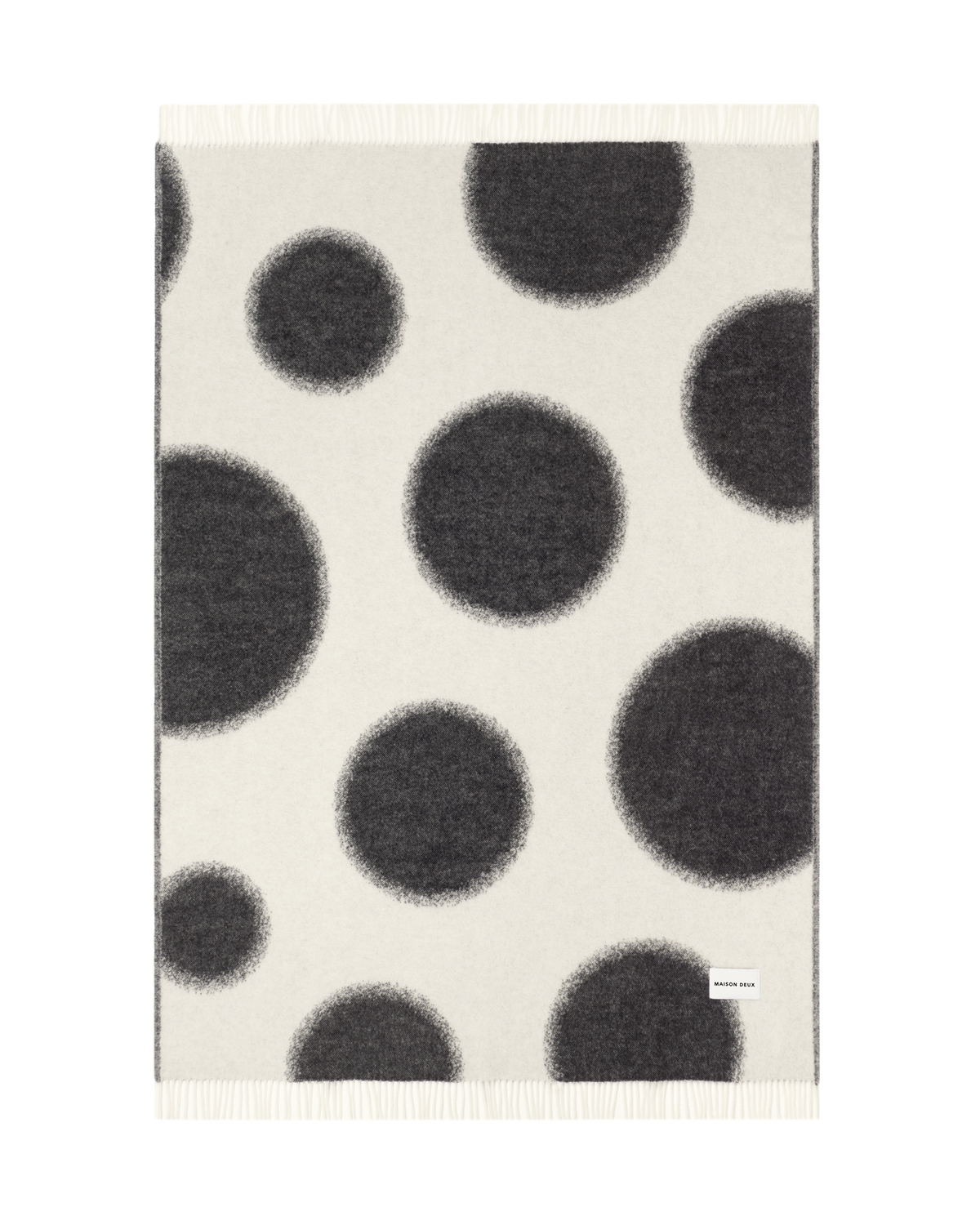 Black and white polka dot wool plaid shown flat
