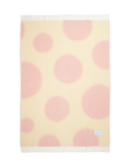 Butter yellow and pink polka dot wool throw shown flat
