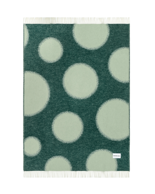 Dark green and sage polka dot wool throw shown flat
