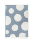 Denim blue and white polka dot wool throw shown flat
