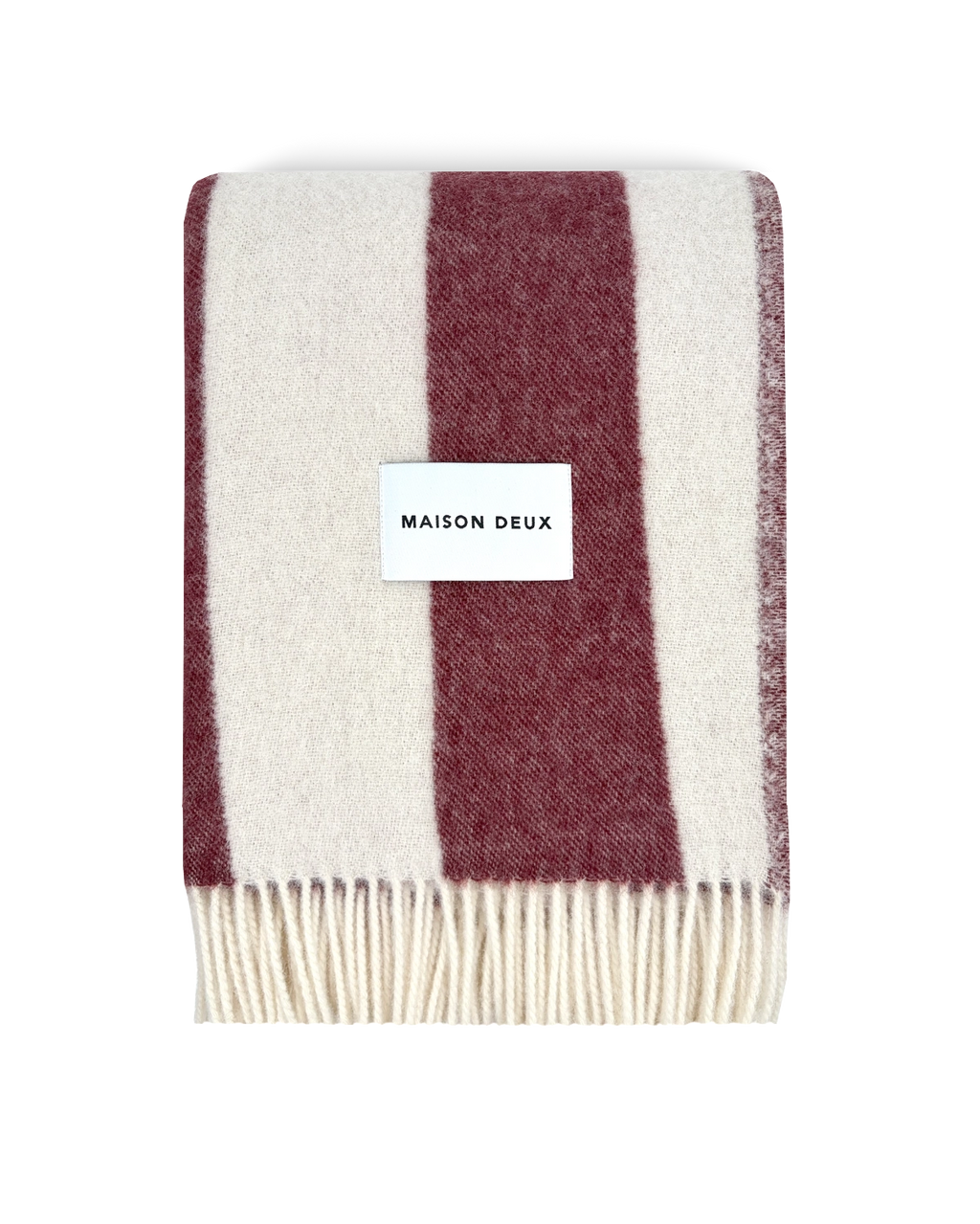 Merlot and white striped wool blanket folded with fringe detail
