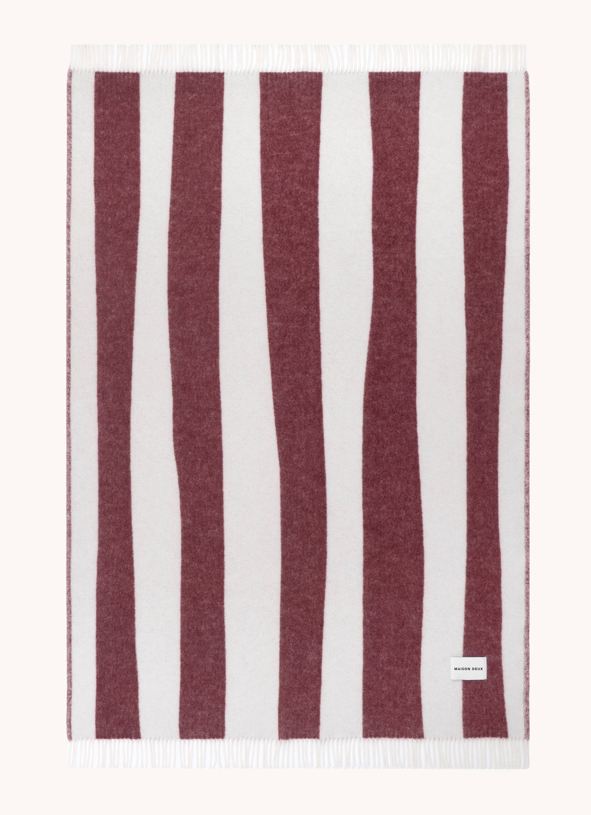 Merlot and white striped wool throw shown flat
