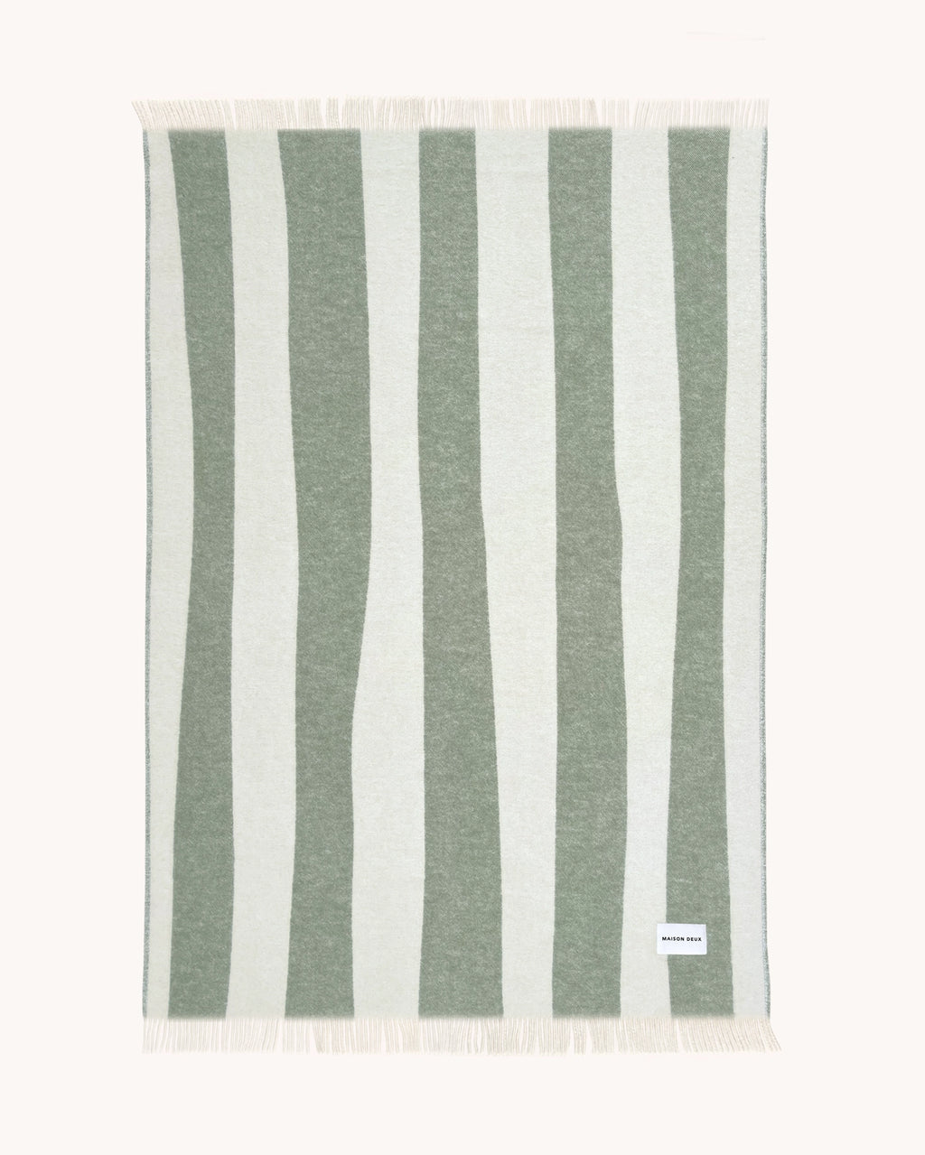 Sage green and white striped wool throw shown flat
