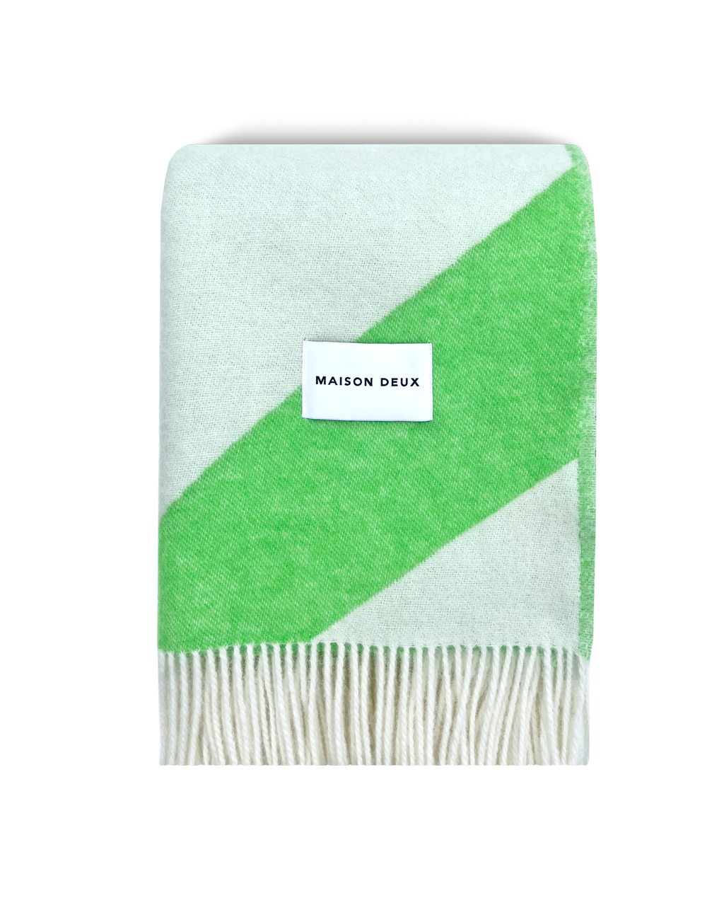 Apple green and white swirl wool blanket folded with fringe detail
