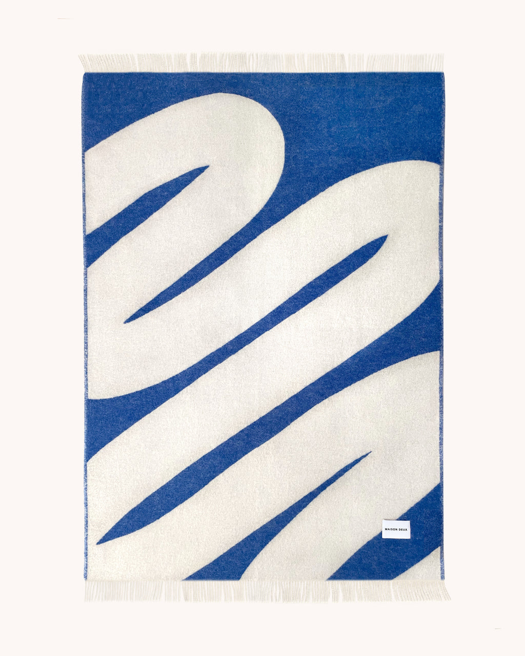 Cobalt blue and white swirl wool throw pattern detail
