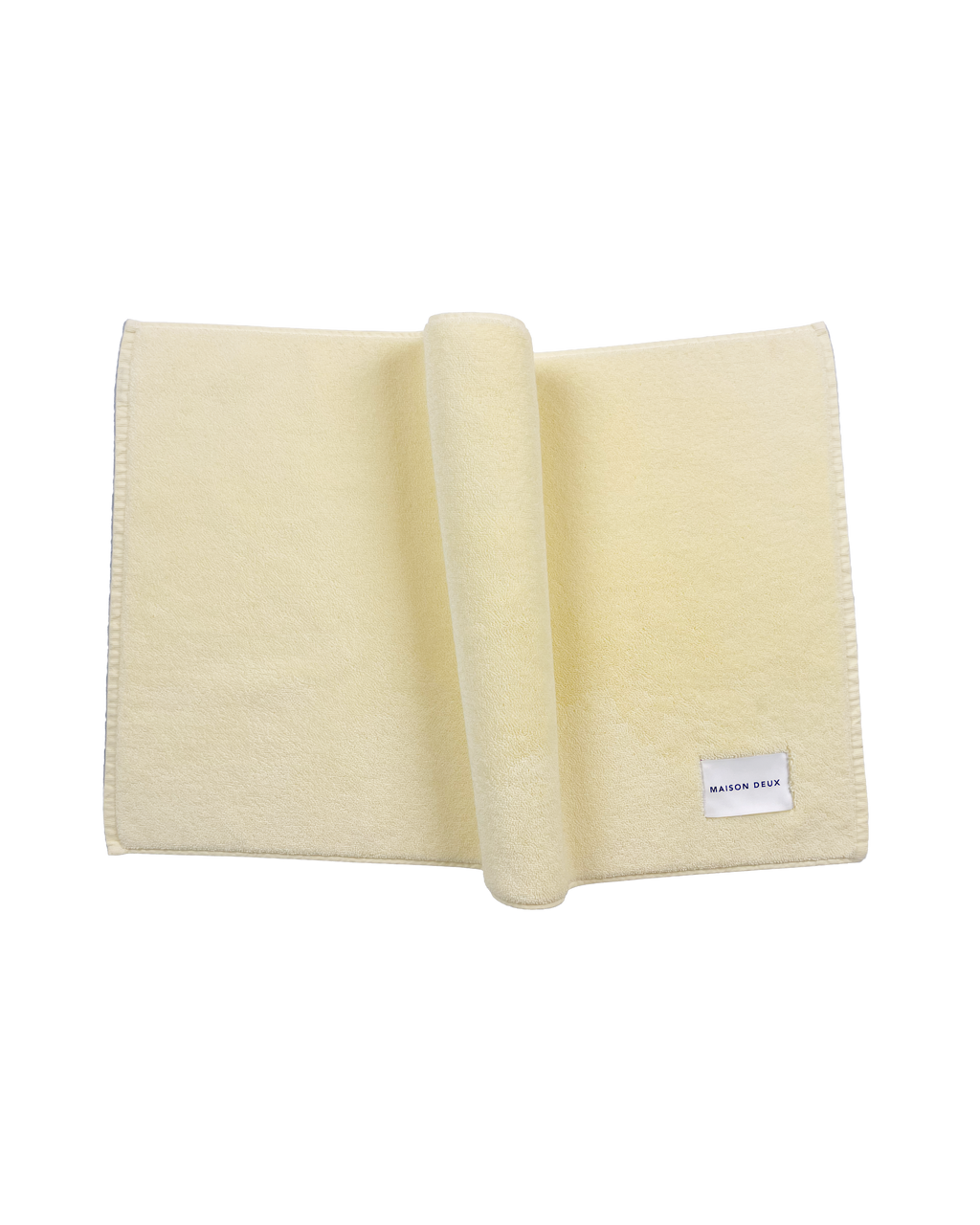 Solid butter yellow organic cotton bath mat