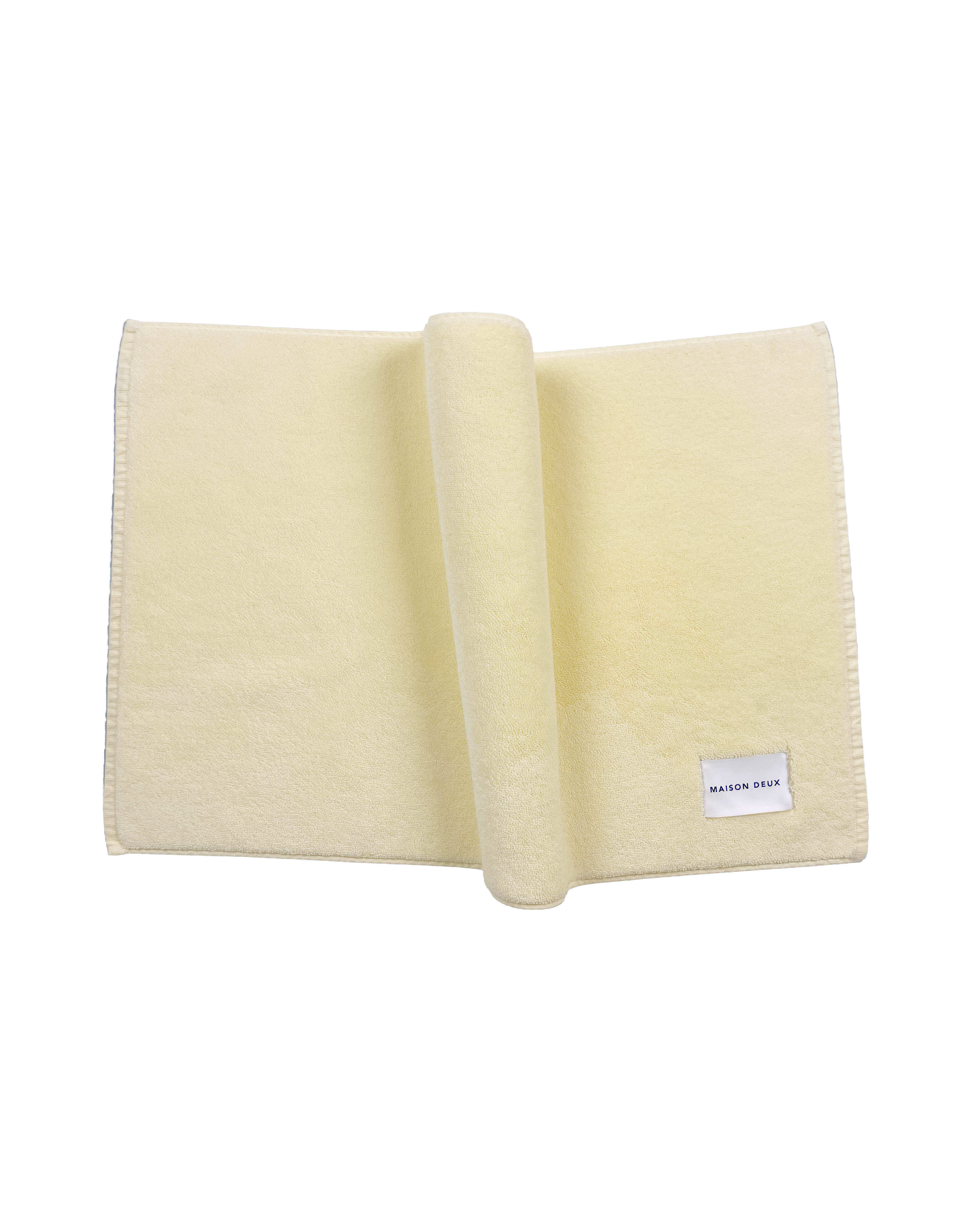 Solid butter yellow organic cotton bath mat