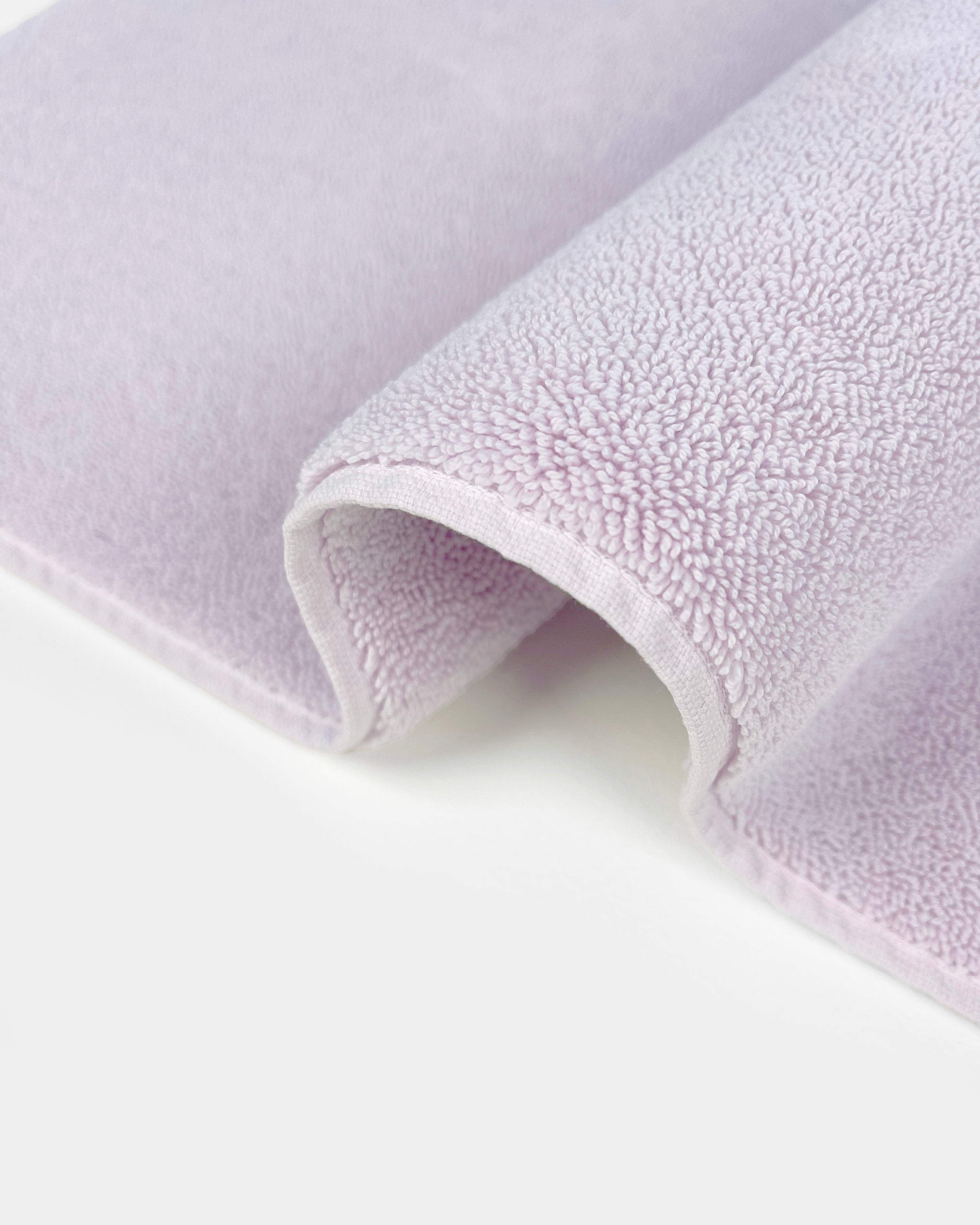 Close-up of dense GOTS-certified terry weave, lilac bath mat