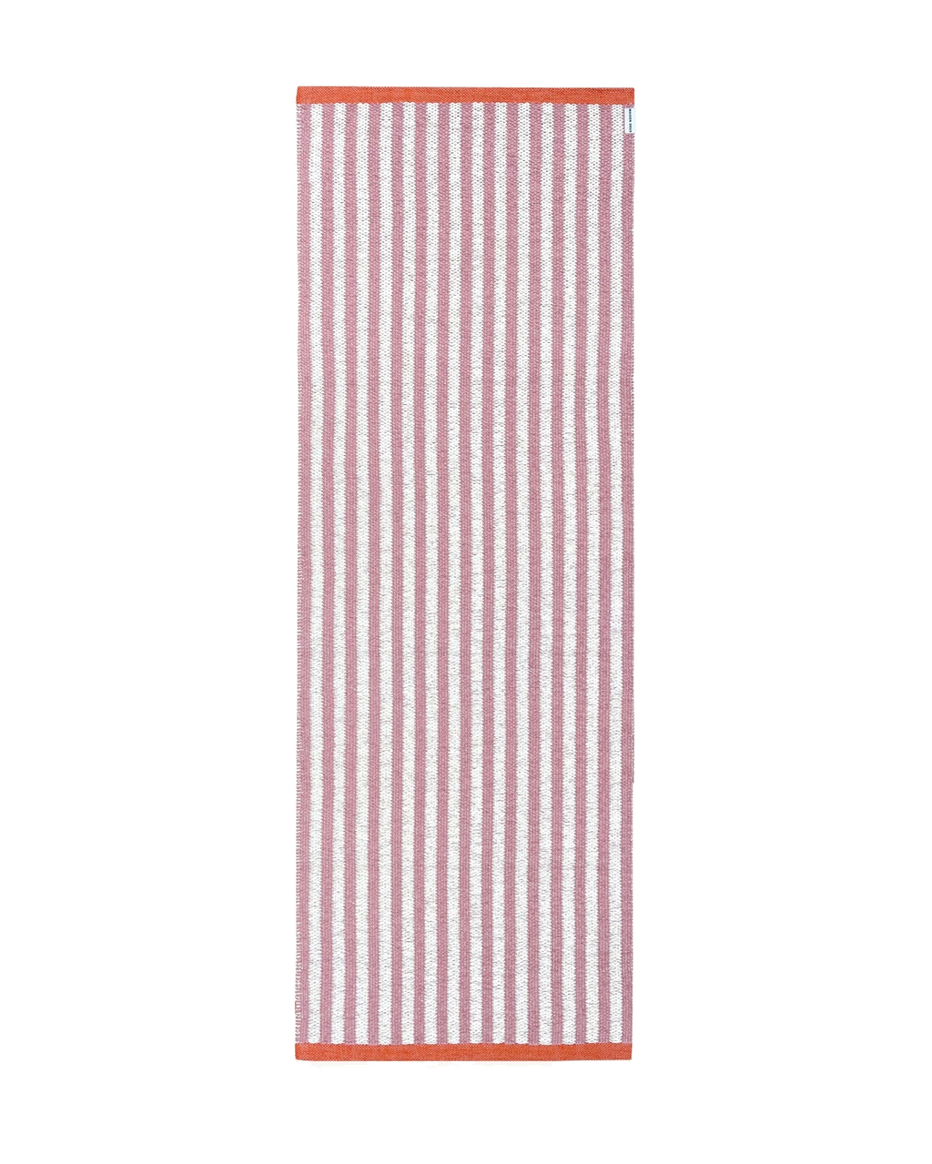 Pink and white striped rug with coral border, rolled