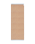 Terracotta orange and white striped rug with blue border, rolled