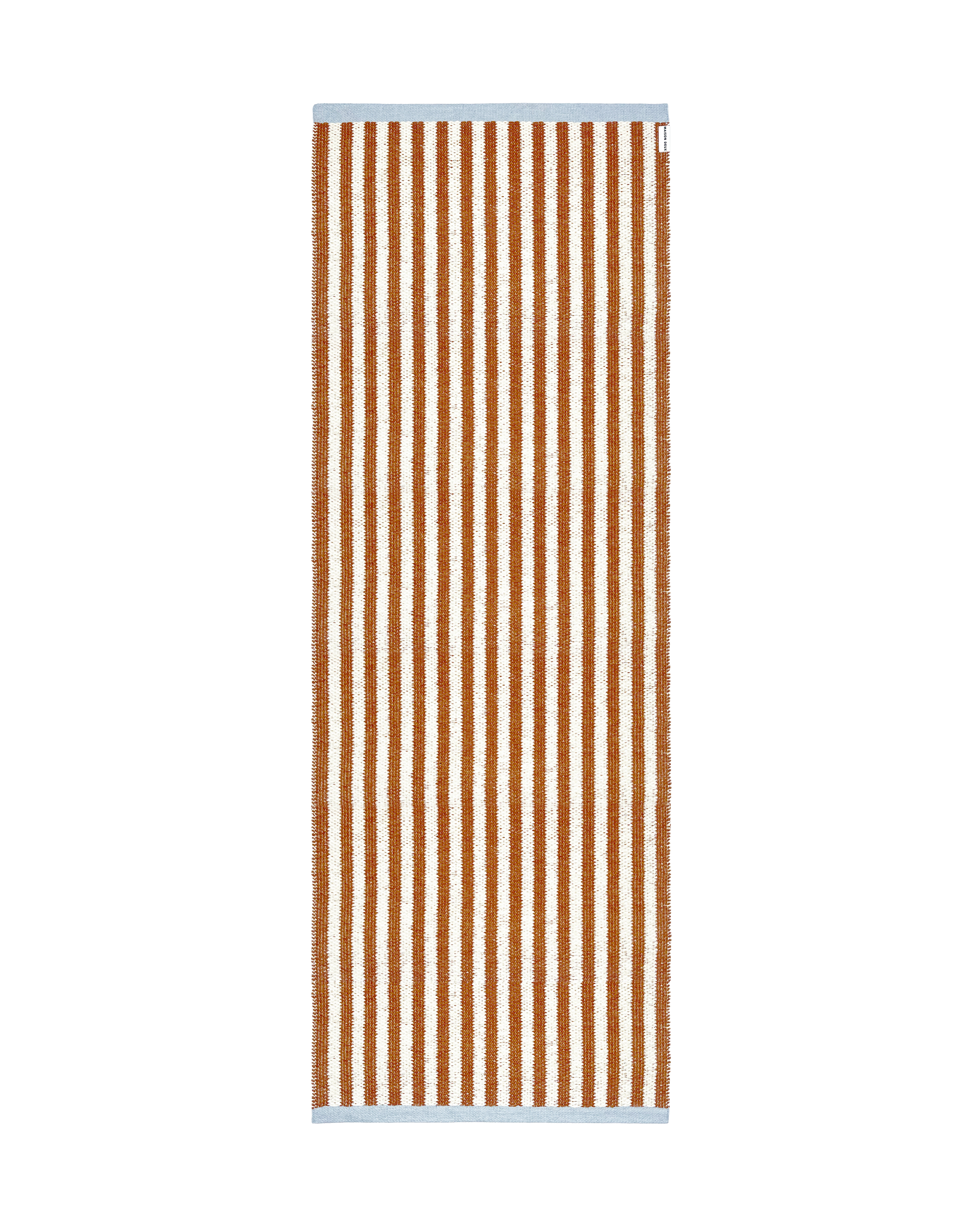 Terracotta orange and white striped rug with blue border, rolled