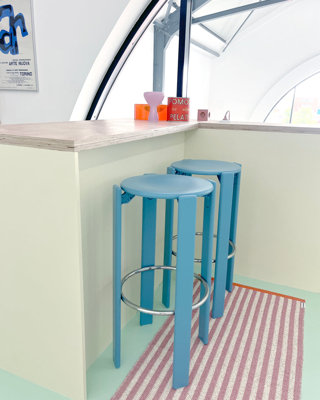 Pink and white striped rug styled as kitchen runner