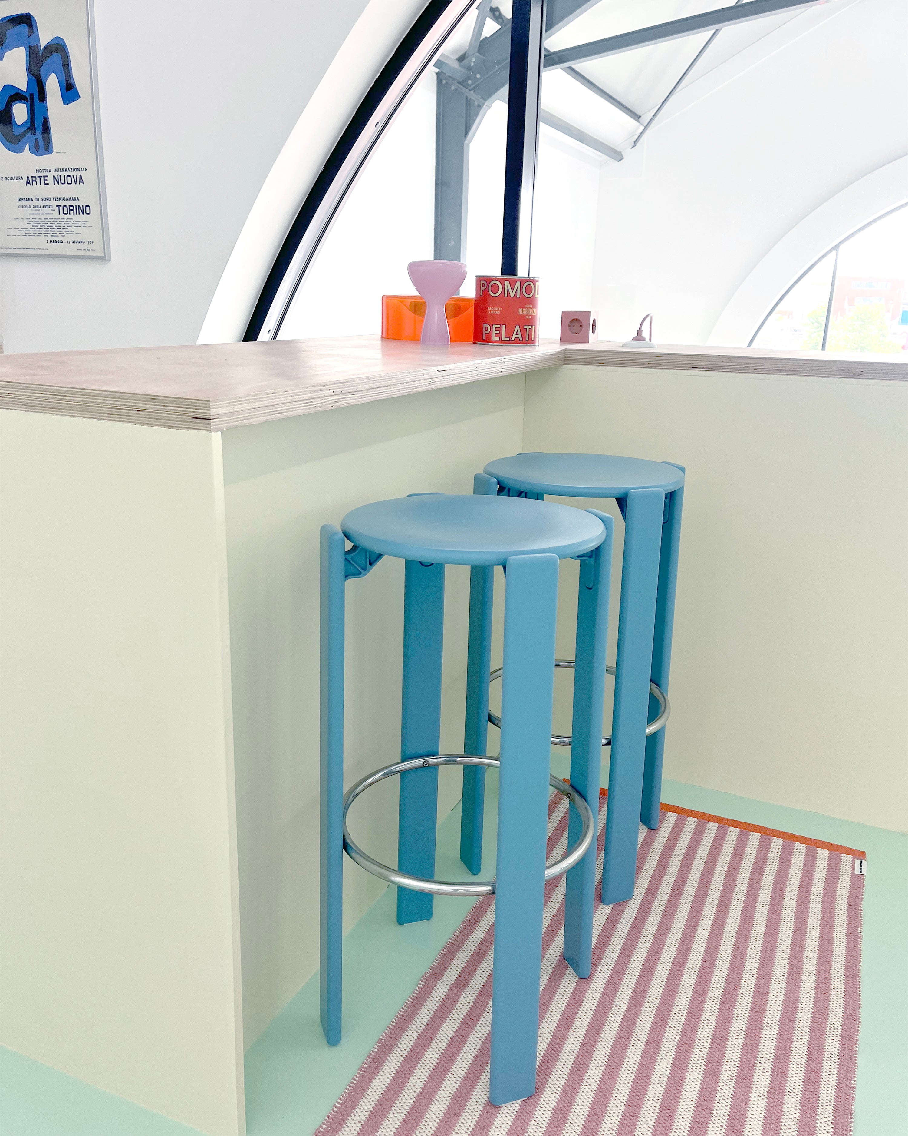 Pink and white striped rug styled as kitchen runner