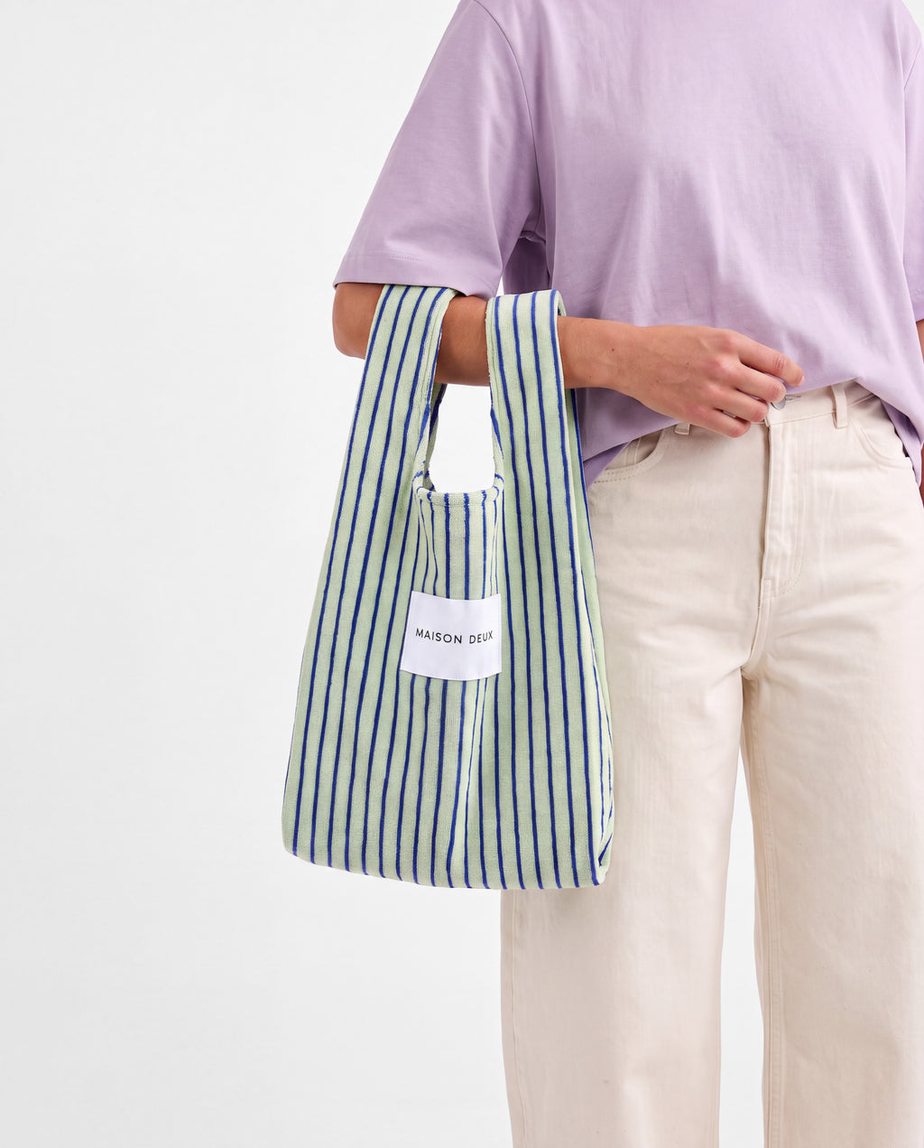Sage and cobalt blue striped mini terry tote bag carried on arm