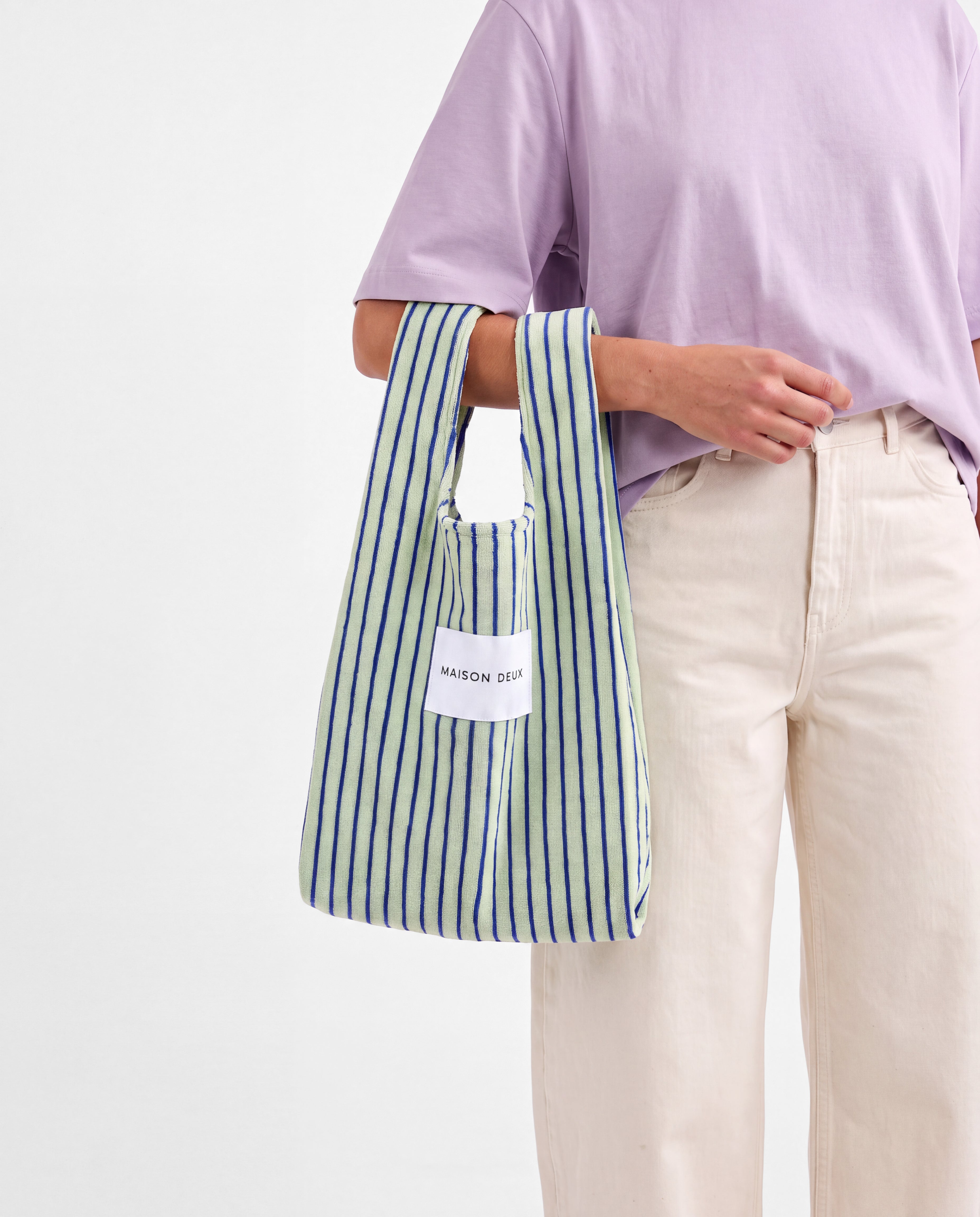 Sage and cobalt blue striped mini terry tote bag carried on arm