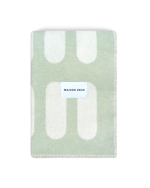 Chill Pill sage green wool throw blanket with plaid pattern and Maison Deux label